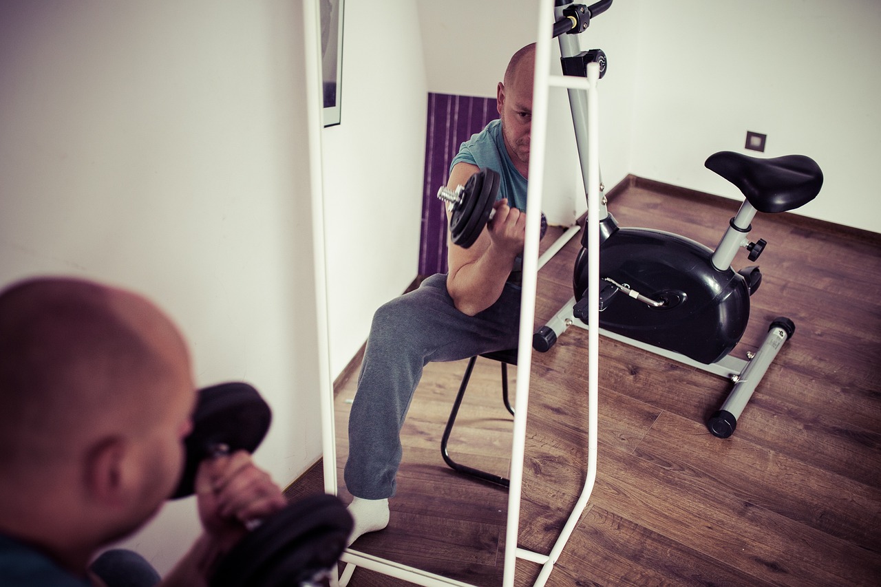 Athlete performing a barbell squat exercise, showcasing proper form and engaging lower body muscles for effective strength training and muscle building.